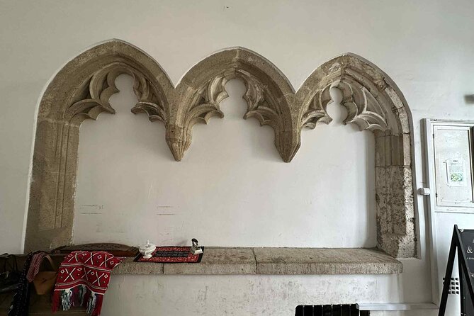 Buda Castle Tour: History and Architecture - Early-1900s Neo-Gothic, WWII damage, and reconstructed faces